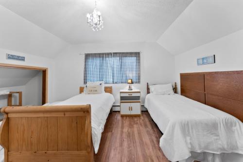 Ένα ή περισσότερα κρεβάτια σε δωμάτιο στο Serpent Lake Getaway