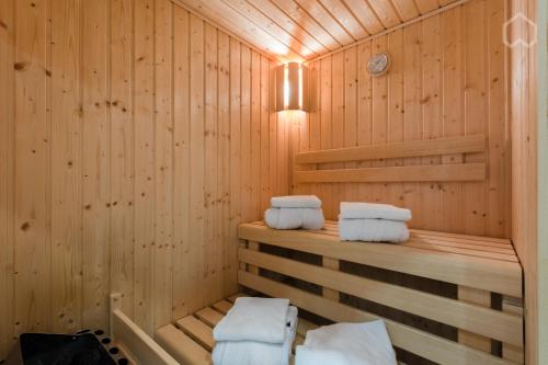 a sauna with three towels sitting on a shelf at Residenz am Zwinger in Dresden