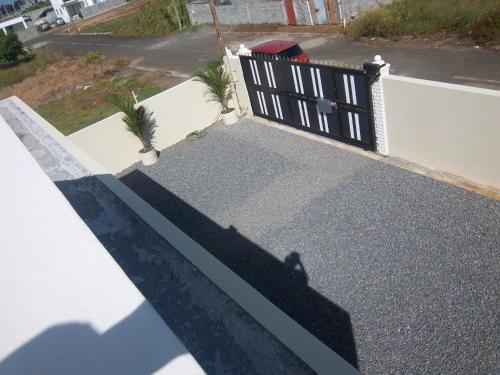 an overhead view of a porch with a black fence at Kaz Resident in Plaine Magnien