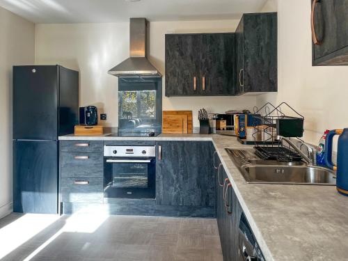 Η κουζίνα ή μικρή κουζίνα στο Oakmere Apartment