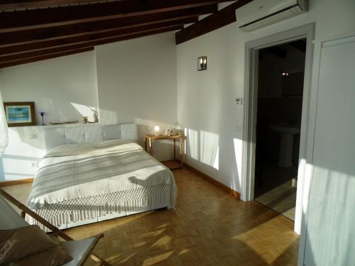 a bedroom with a bed in the corner of a room at Apartment in Vello by Lake Iseo Beach in Marone