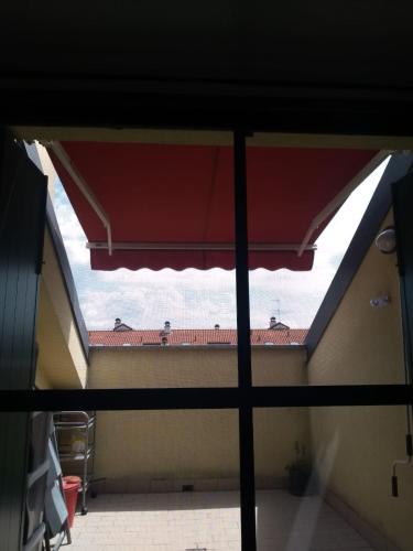 a view from a window of a building with a roof at Un posto tranquillo a Milano in Milan