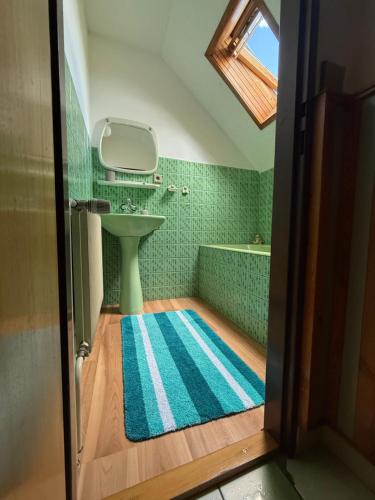 a bathroom with a sink and a bath tub at Pension Barborka in Jičín