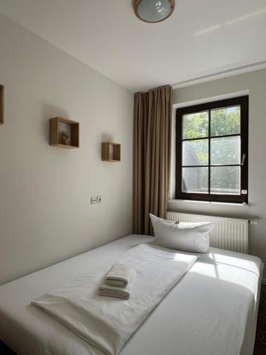 Кровать или кровати в номере Hotel Ostseeland