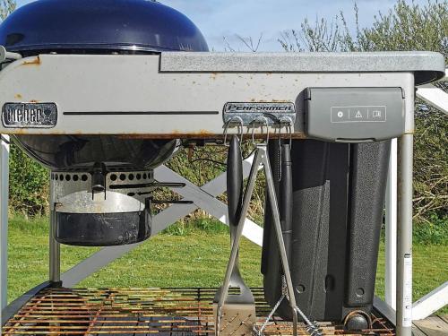 a bbq grill sitting on top of a table at Modern Retreat at Knud Strand - By Traum Ferienwohnungen in Spottrup