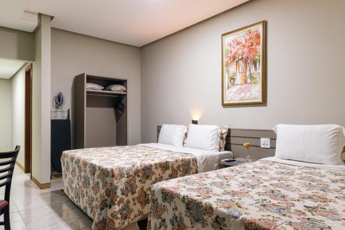 Voodi või voodid majutusasutuse Hotel Dan Inn Uberlandia By Nacional Inn toas