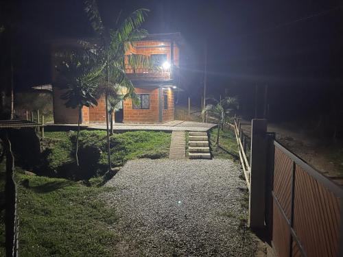 a house at night with a pathway leading to it at Aloha Campestre in San Rafael