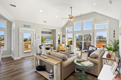 a living room with a couch and a table at 8305 - The Sound of Sunshine in Avon