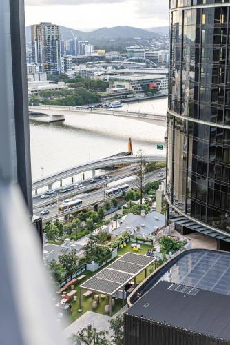 a view of a city and a river from a building at Skyscraper Cinema - Dream a thousand city lights in Brisbane