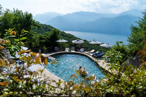 a swimming pool with a view of the mountains at Hotel Querceto Wellness & Spa - Garda Lake Collection in Malcesine