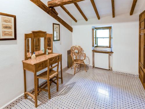a bathroom with a wooden dressing table and a mirror at Tuscany Villa with Terrace in Ansedónia