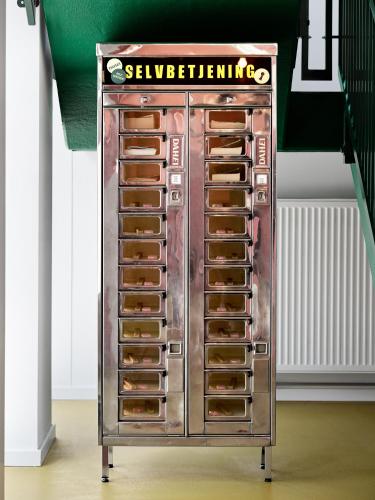 a metal cabinet with many drawers in a room at Dahei Apartment Hotel in Copenhagen