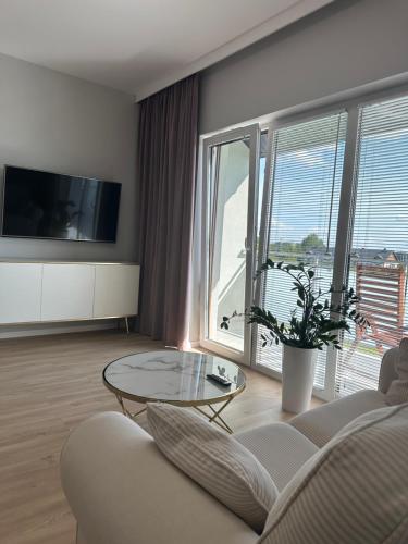 Televisyen dan/atau pusat hiburan di Apartament Magiczny Horyzont