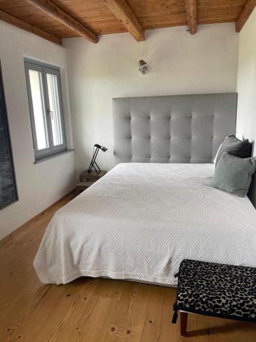 Postel nebo postele na pokoji v ubytování Casale nel mezzo dei vigneti