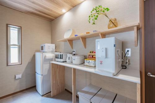 Una cocina o cocineta en 陶霞の宿 Toka no Yado