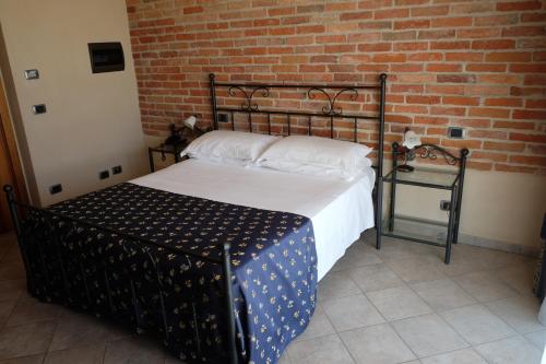 Postel nebo postele na pokoji v ubytování Hotel Le Botti