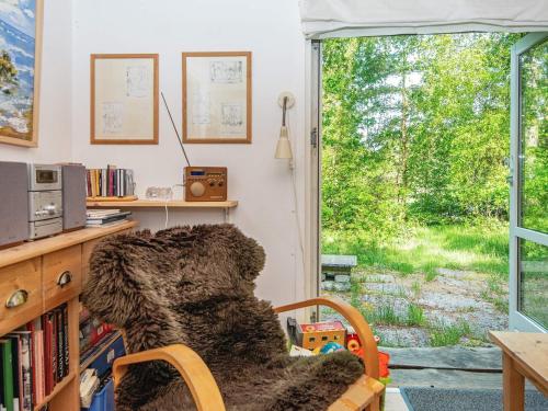 a living room with a chair and a window at 4 person holiday home in Bryrup-By Traum in Bryrup