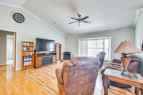 a living room with a couch and a table at Golf Course Views! Home 10 Mi to Crystal River in Citrus Springs