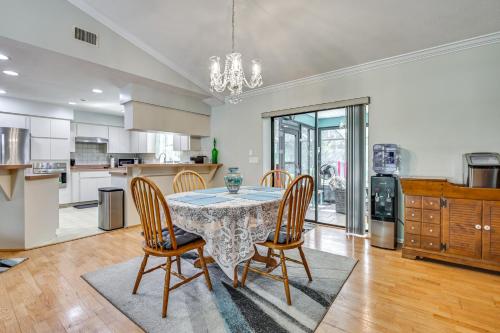a dining room with a table and chairs at Golf Course Views! Home 10 Mi to Crystal River in Citrus Springs