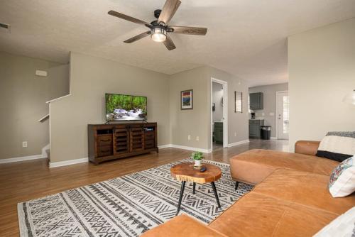 a living room with a couch and a ceiling fan at Peaceful Escape 2BR Retreat w Private Hot Tub in Sevierville