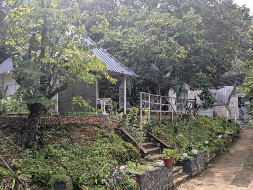 a garden in front of a house at Ashokavanam Heritage Village by N Square in Kanthalloor