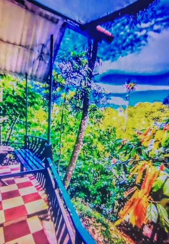 a painting of a bench next to a garden at Green porticos villa munnar #MUNNAR in Anachal