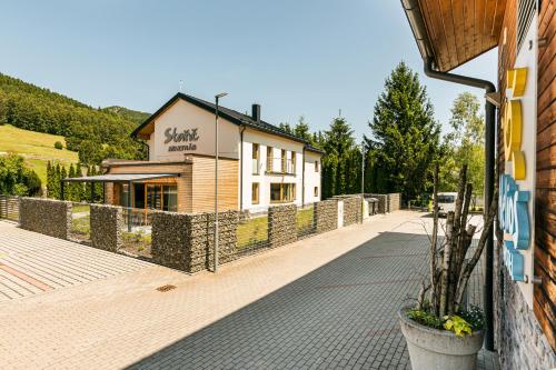 a building on the side of a street at Hotel Helios in Lipova Lazne