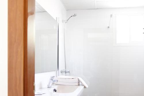 a bathroom with a sink and a mirror at Morlans Garden in Paguera