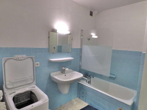 a bathroom with a sink and a toilet and a sink at Appartement lumineux au ski pour 6 - Grand balcon, cœur du village - FR-1-458-96 in Le Grand-Bornand