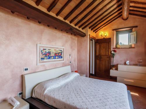 a bedroom with a white bed and a sink at Luxury pool villa in Cortona in Cortona