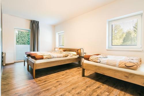 Una cama o camas en una habitación de Apartmán Staříč
