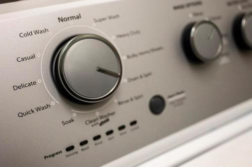 a close up of a control panel of a washing machine at Comfortable Stay Private Hot tub W Arcade in Sevierville