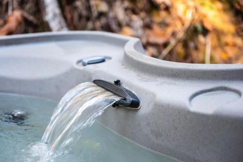 a water faucet in a bath tub at Comfortable Stay Private Hot tub W Arcade in Sevierville