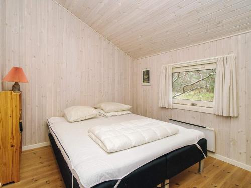 a bed in a room with a window at Cozy Retreat in Rorvig Haven-By Traum in Rørvig
