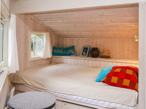 a bed in a small room with a window at Cozy Retreat in Rorvig Haven-By Traum in Rørvig