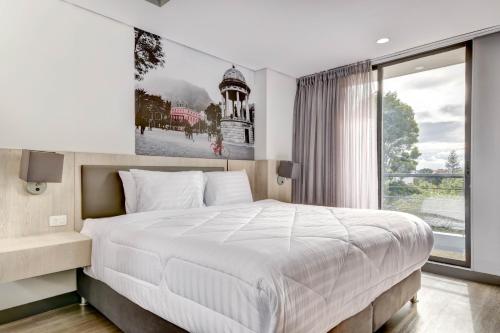 Postel nebo postele na pokoji v ubytování Home Suites 118 By gA