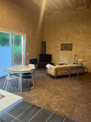 a living room with a couch and a table at Park Residence Bei Wu in Wesenberg