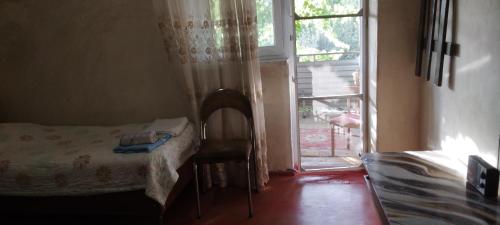 Ein Bett oder Betten in einem Zimmer der Unterkunft Shushan GUEST HOUSE