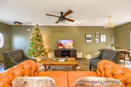 a living room with a christmas tree and a tv at Peaceful Getaway Hot Tub Perfect Location in Sevierville