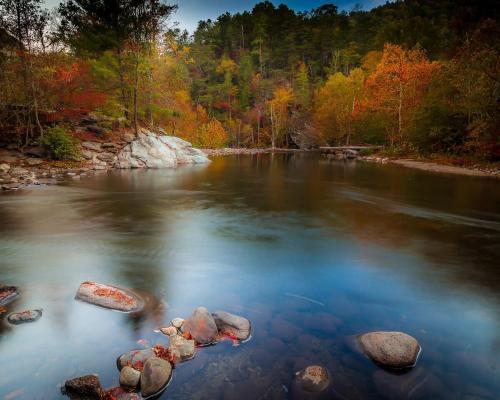 a river with rocks in the middle of the water at Peaceful Getaway Hot Tub Perfect Location in Sevierville