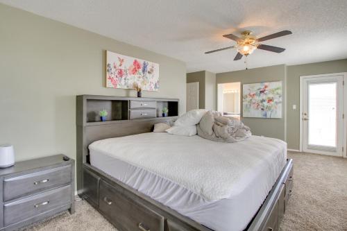 a bedroom with a bed and a ceiling fan at Explore ABQ and Rancho Rio Family Home with Patios! in Rio Rancho
