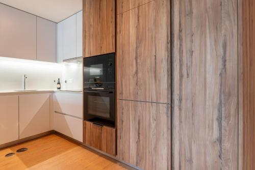 Premium Apartment w/ Garage & Balcony by HostWise