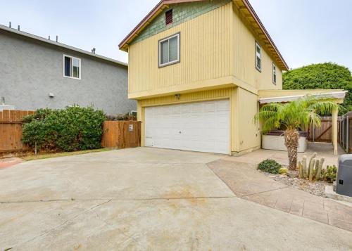 a house with a large driveway in front of it at 2 Mi to Ocean Pet-Friendly Imperial Beach Retreat in Imperial Beach