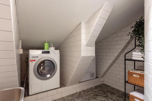 a laundry room with a washer and dryer at Bob W Stockholm Gamla Stan in Stockholm