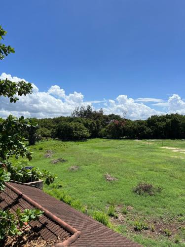 a large field of grass with a blue sky at 1bedroom Nyali in Nyali