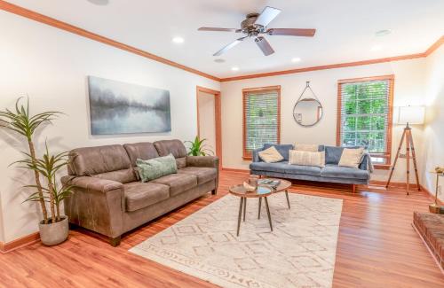 a living room with a couch and a table at 4 Beds ,King Bed, Tvs, Kids essentials, office, Grill, Crib, in Bond park ,PNC Arena in Cary