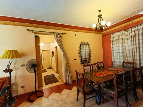 a dining room with a table and chairs at مارينا الساحل الشمالى in El Alamein