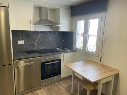 Kuchyň nebo kuchyňský kout v ubytování Apartamento Paseo Malécon Planta 3