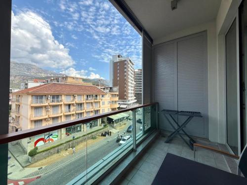 an apartment balcony with a view of a city at Condo Studio Plaza in Budva