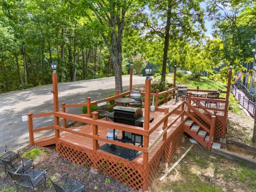 a wooden bridge in a park with picnic tables at Relaxing Escape Pool Access & Close to Dollywood in Pigeon Forge